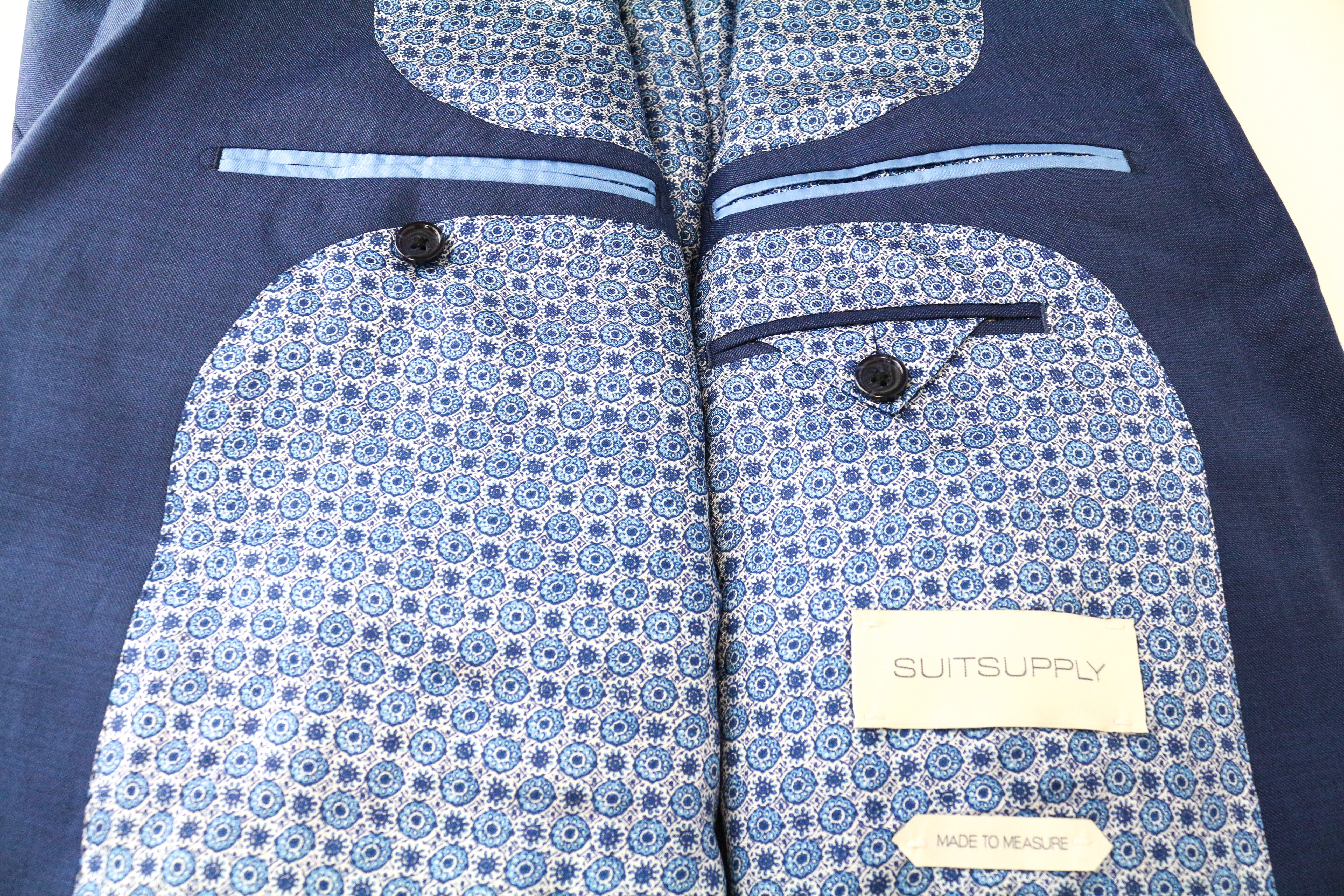 SUITSUPPLY Lazio UK52S vyriškas mėlynas švarkas su vilnoniu pamušalu ir sagomis 