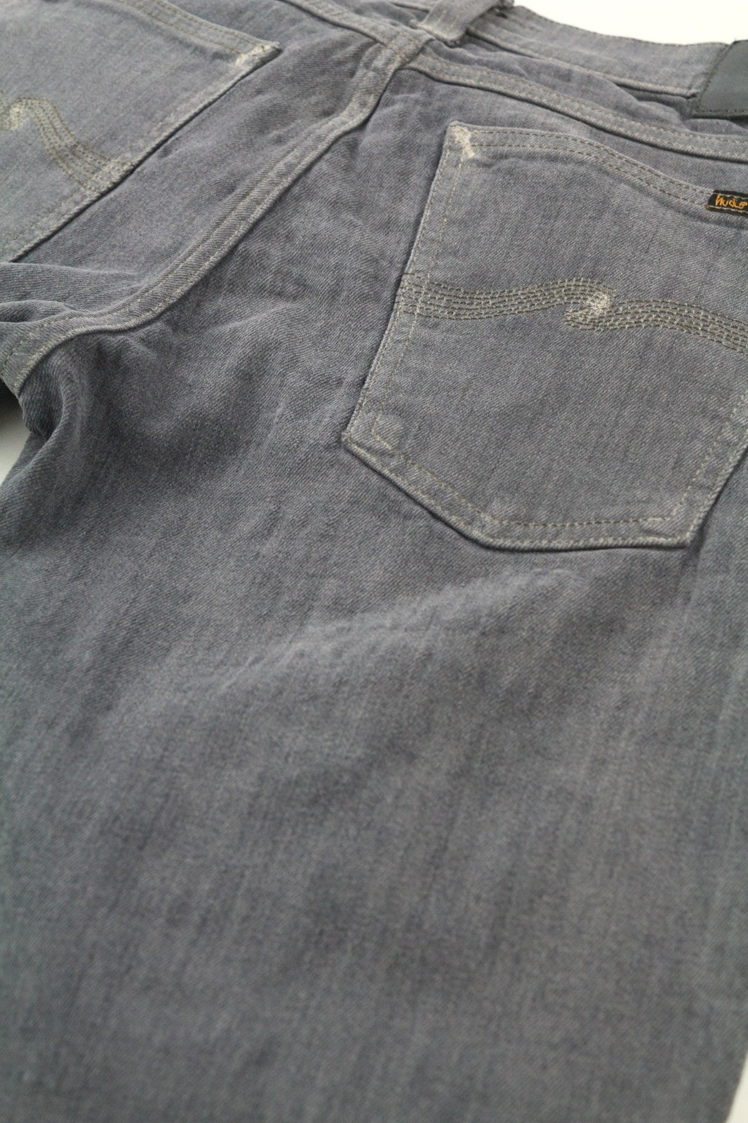 NUDIE JEANS vyriški aptempti ilgi John džinsai W31/L34 anglies spalvos, ekologiško užtrauktuko, plono kirpimo 