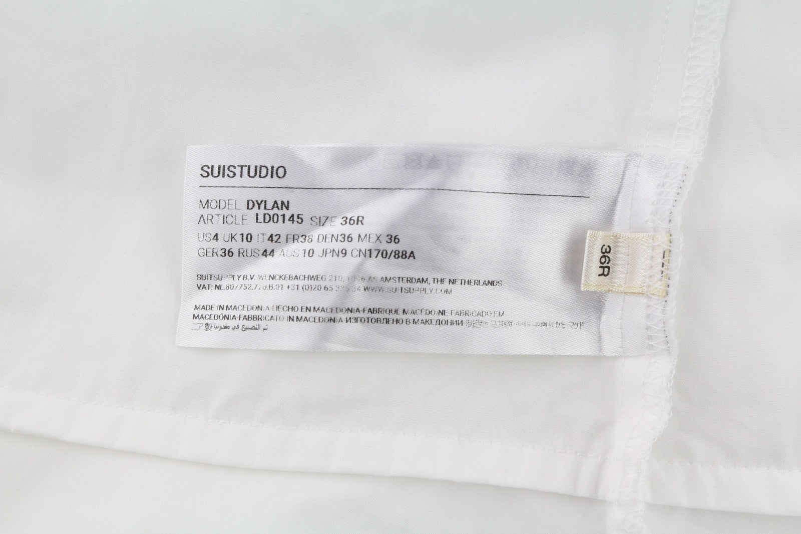 SUISTUDIO Dylan moteriška suknelė UK10 balta medvilninė ilgomis rankovėmis apvali apykakle trumpi logotipai 